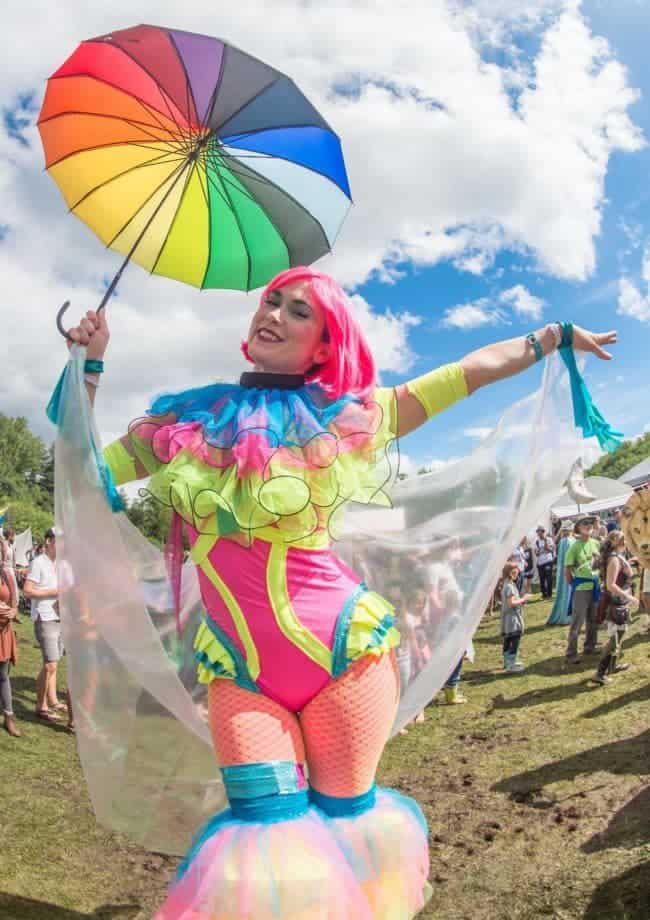 Stilt Walker leading parade at Lake Eden Arts Festival | Mindy | Imagine Circus Performers | Photo by Steve Atkins