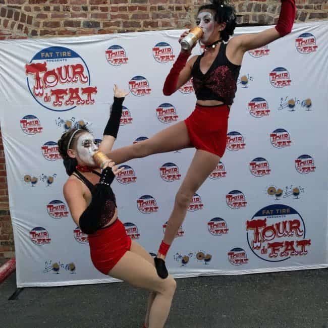 Acrobats enjoying a beer at Tour de Fat in Charlotte, NC | Kaci & Katie | Imagine Circus Performers