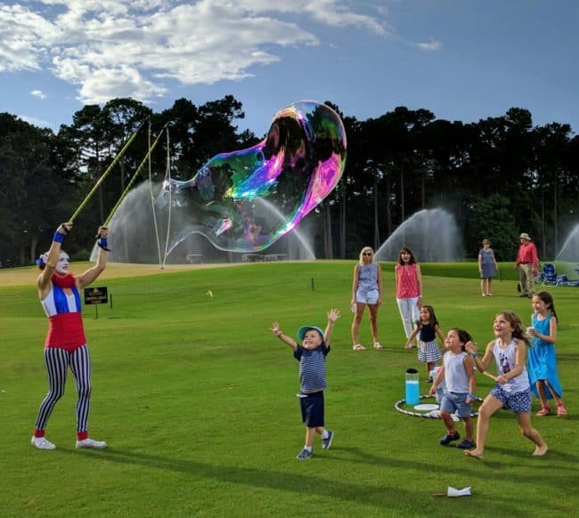 Bubble Artist Katie making giant bubbles on July 4 | Raleigh North Ridge Country Club | Imagine Circus