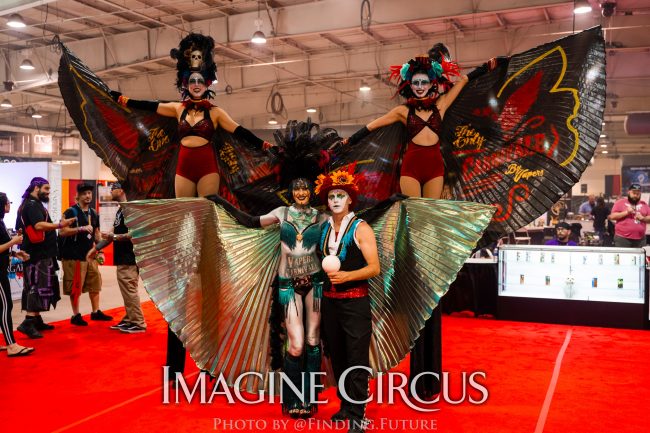 Dark Circus, Stilt Walkers _ Juggler, Tik-Tok Liz Kaci and Adam, Logo Branded Wings, Vapers Carnivale, Imagine Circus Performers, Photo by Finding Future