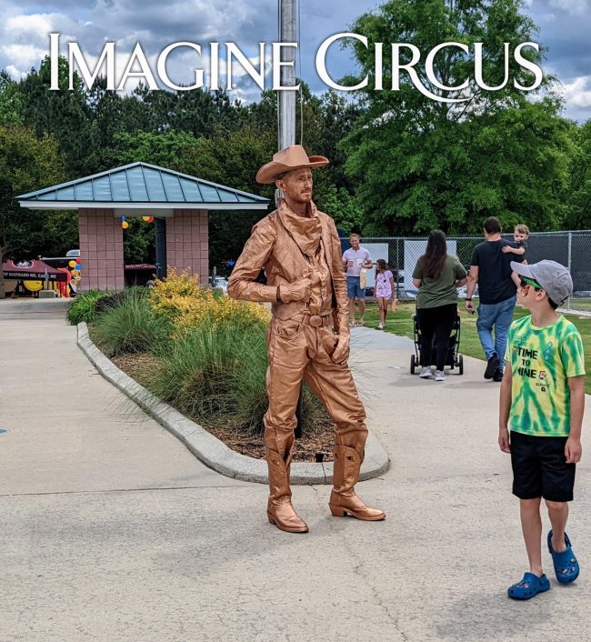 Bronze Statue with Onlooker, Cowboy Living Statue, Imagine Circus, Performer